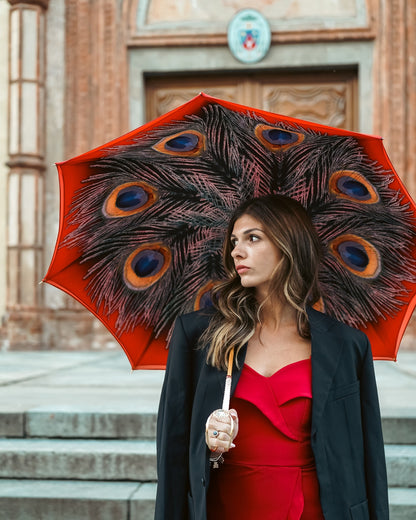 Red satin women's umbrella with peacock print, designer rain umbrella by Ilmarchesato, elegant and stylish for rainy days.