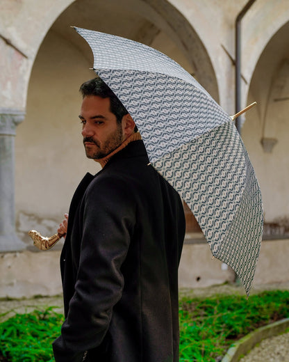 Luxury gold umbrella for men with 24K gold handle and automatic rain protection, featuring a stylish hound dog design by Ilmarchesato