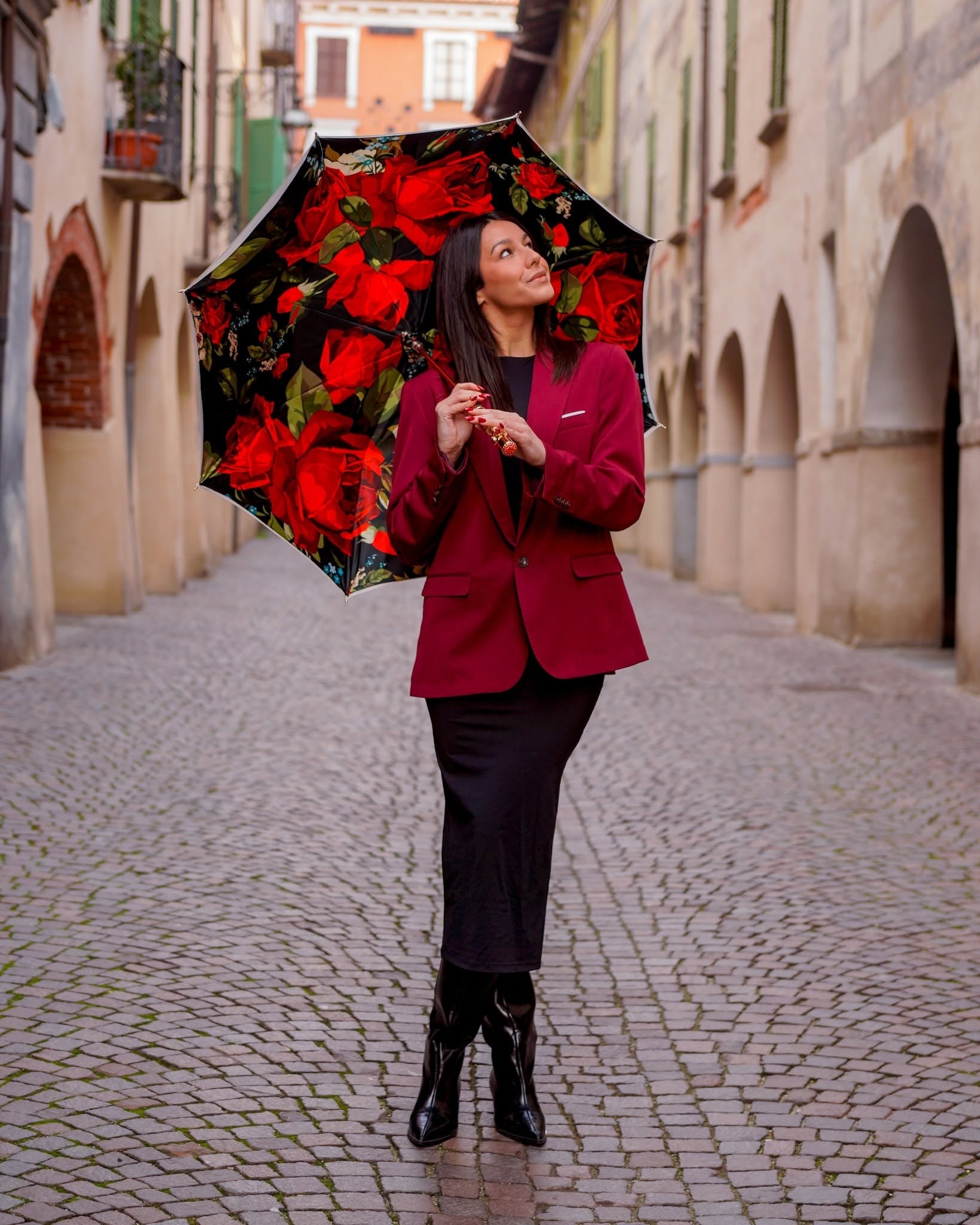 Royal Rose luxury rain umbrella by Ilmarchesato with gold handle and carbon fiber frame, open to show floral design and craftsmanship.