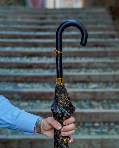 Luxury black gold men's umbrella with Italian handmade leather handle and skull detail, stylish and durable for sophisticated protection.