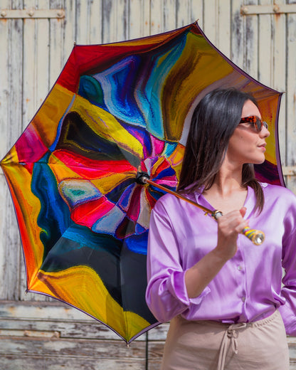 Gold plated handcrafted Italian rain umbrella with crystal handle, stylish and luxurious for rainy weather.