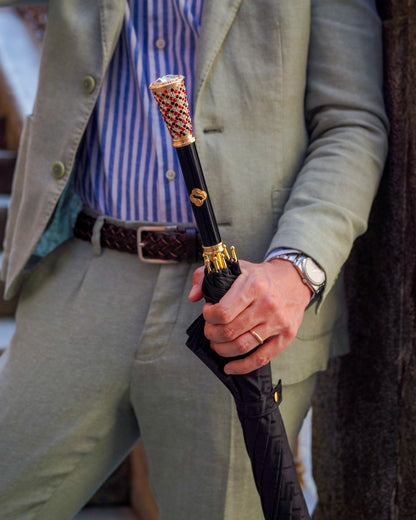 Luxury men's Black Greca umbrella by Ilmarchesato with gold handle and crystal accents, stylish rain protection for men.