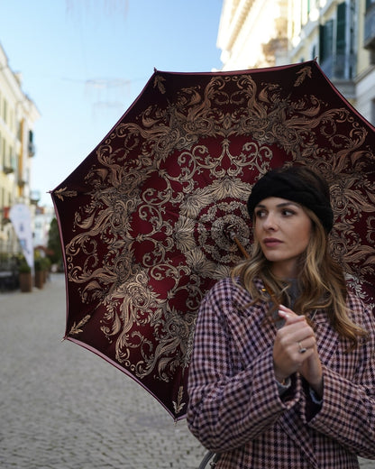 Luxury Burgundy rain umbrella by Ilmarchesato featuring automatic opening, regal crown design, and red stone handle.