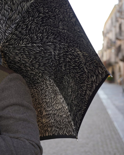 Black men's umbrella with hand-painted wolf handle by Ilmarchesato, stylish rain protection and luxury design.