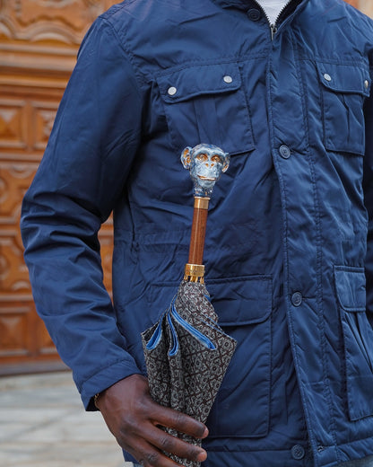 Italian handmade men's umbrella with 24K gold-plated enameled monkey handle and classic fabric canopy.