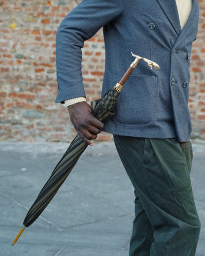 Black pinstripe men's umbrella by Ilmarchesato with 24K gold handle and automatic opening for stylish rain protection.