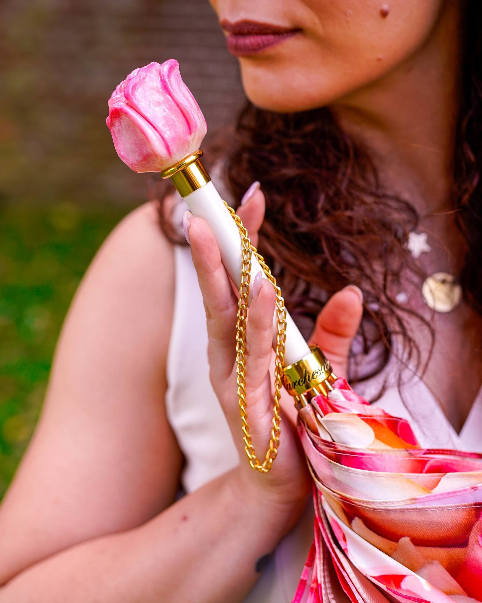 Elegant women's rain umbrella by Ilmarchesato with a hand-painted rose handle and premium craft design.