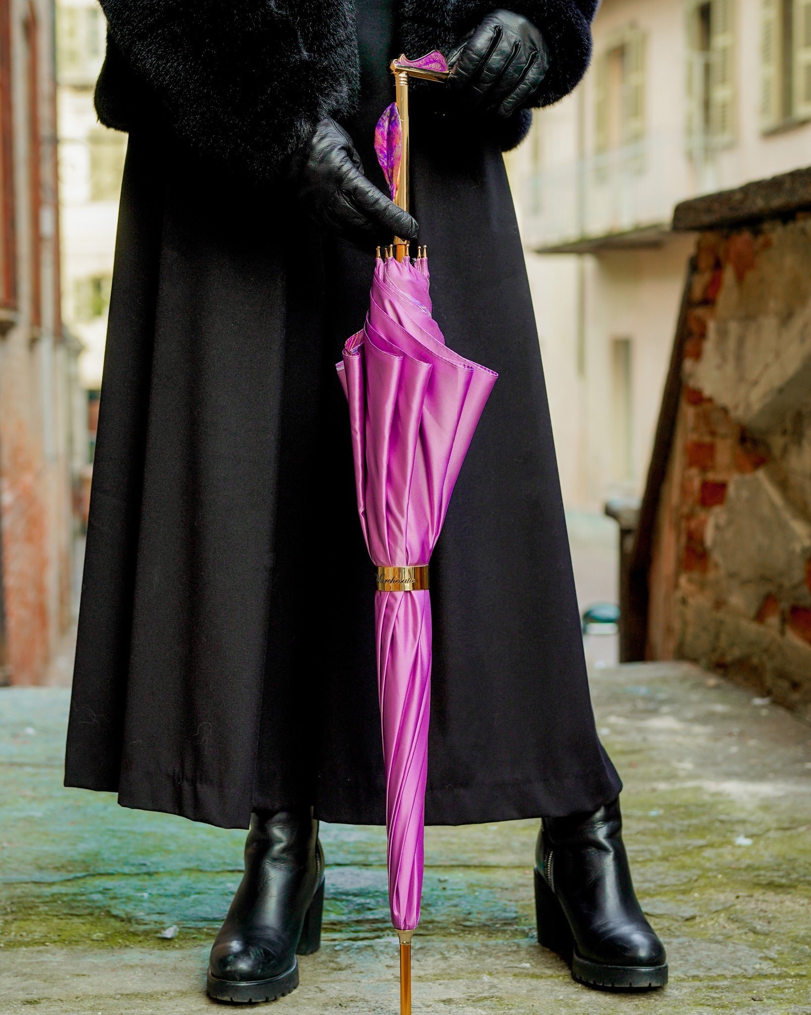 Luxury pink rain umbrella by Ilmarchesato with hand-painted floral handle, satin canopy, and wind-resistant design.