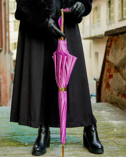 Luxury pink rain umbrella by Ilmarchesato with hand-painted floral handle, satin canopy, and wind-resistant design.