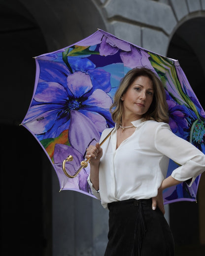 Handmade lilac flowered rain umbrella by Ilmarchesato with satin canopy and amethyst crystal handle, perfect for rainy days.