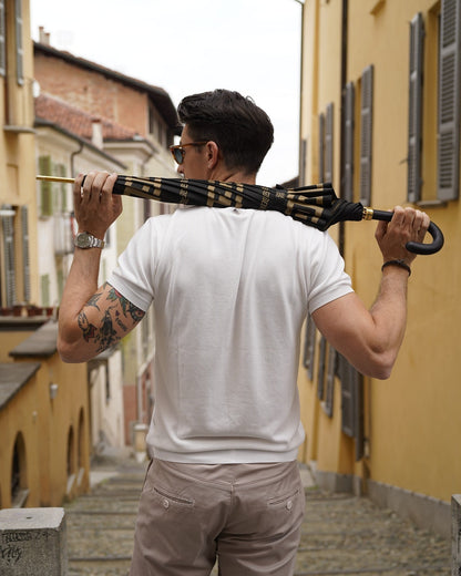 Italian leather handle umbrella for men with fiber carbon frame by Ilmarchesato, showcasing a stylish rain gear design.