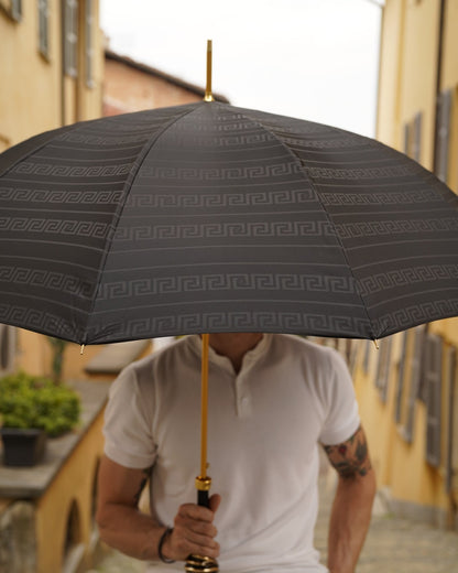Men's luxury umbrella by Ilmarchesato with gold-plated handle and automatic opening, featuring a sleek canopy for rain protection.