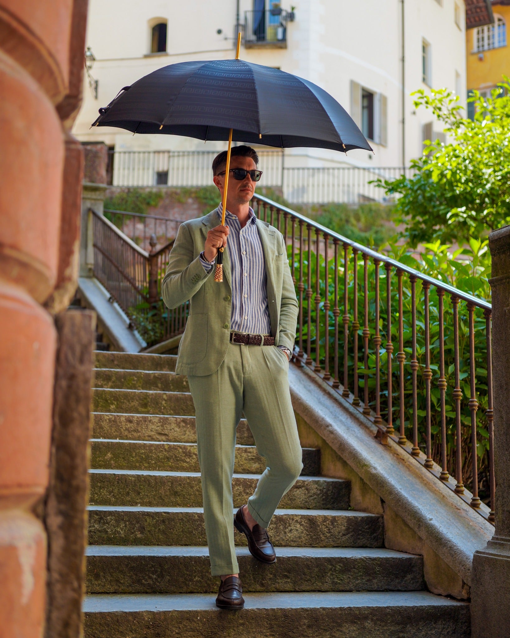 Black Greca men's umbrella by Ilmarchesato with gold handle and crystal accents, stylish rain protection for men.