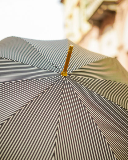 Black striped men's umbrella by Ilmarchesato with a 24K gold horse handle, stylish luxury rain protection for gentlemen.