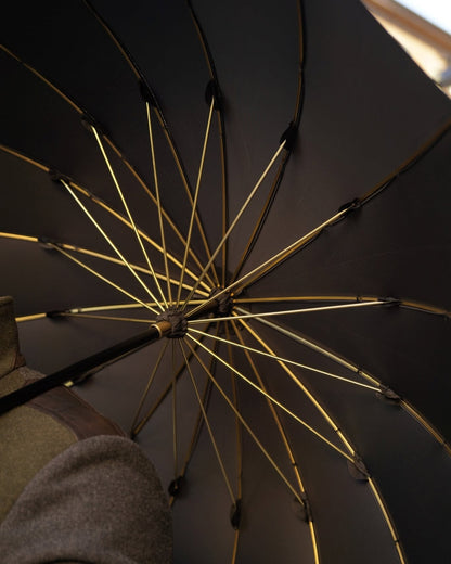 Black jacquard umbrella for men with a gold handle and crystal droplets, handmade by Ilmarchesato.