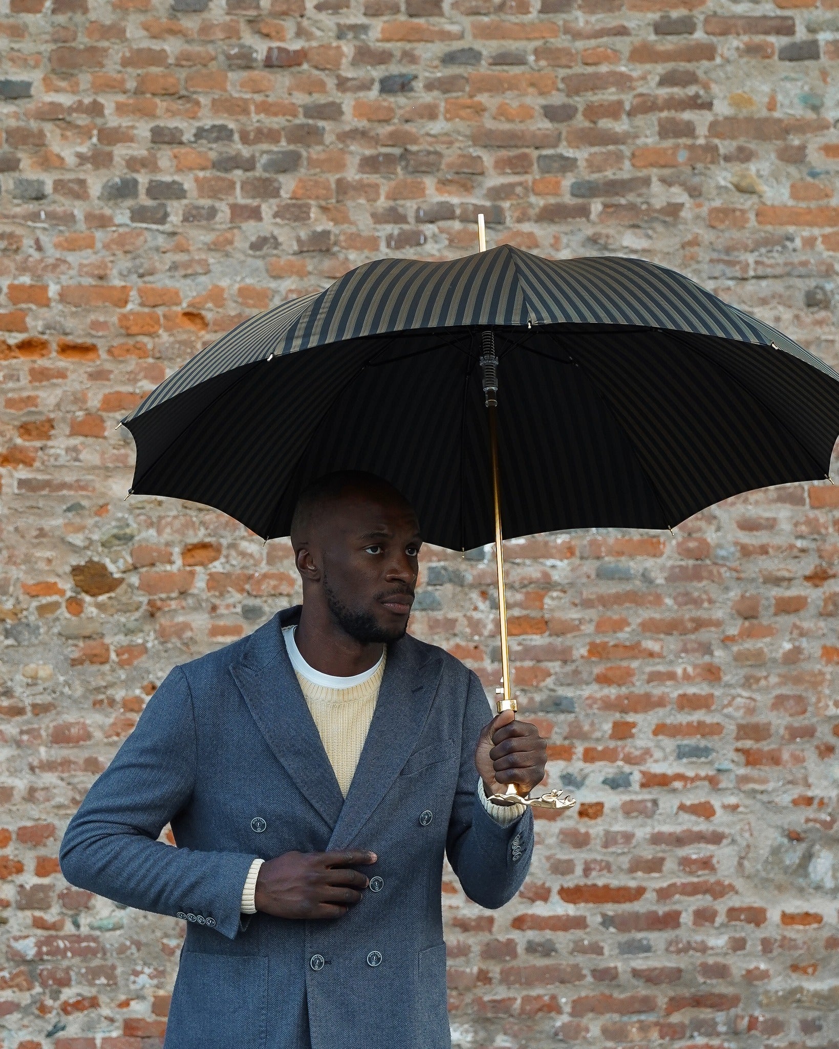 Black pinstripe men's umbrella with 24K gold handle and automatic opening by Ilmarchesato, stylish rain gear for men