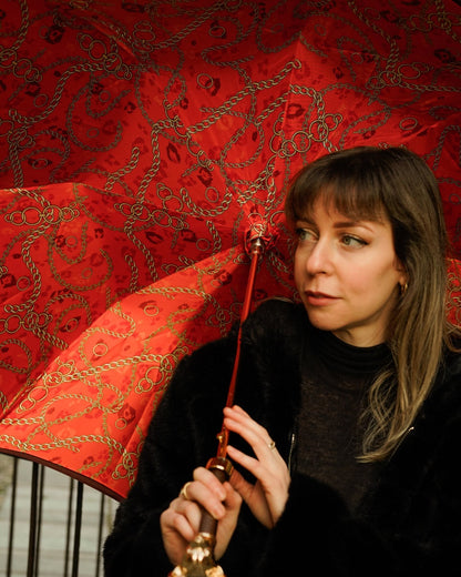 Red luxury Ilmarchesato rain umbrella with satin finish, gold Chihuahua handle, automatic opening, stylish and elegant design.