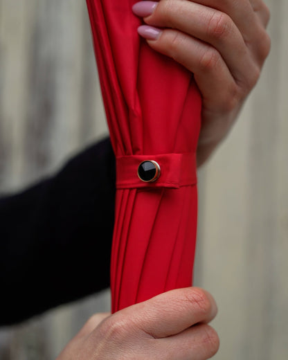 Red designer rain umbrella by Ilmarchesato with jeweled panther handle, limited edition luxury rain umbrella, stylish and elegant.