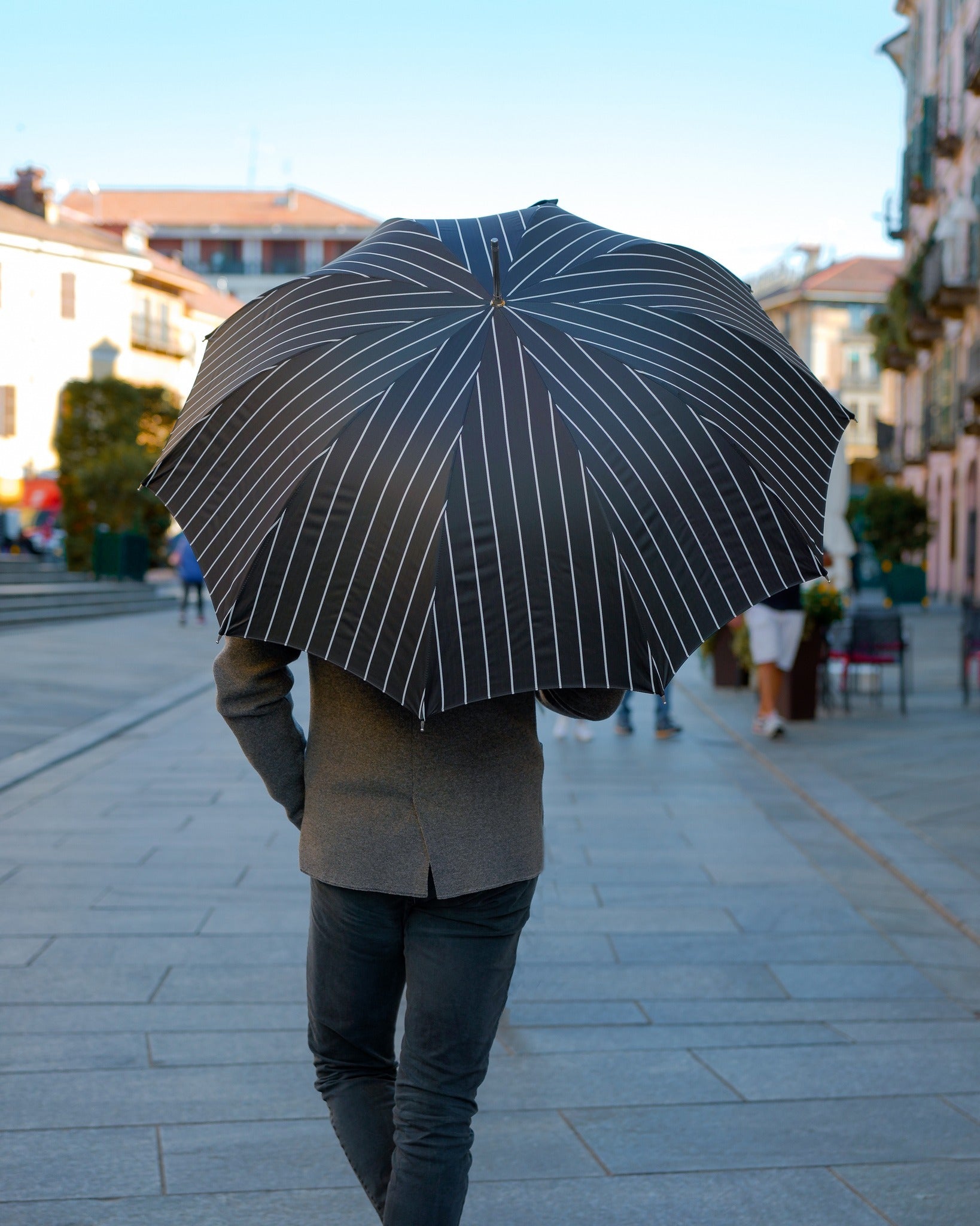 Black pinstripe men's rain umbrella with sculpted jaguar handle and automatic open feature by Ilmarchesato.