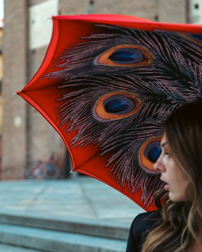 Elegant red satin women's rain umbrella with peacock print, featuring a designer style by Ilmarchesato.