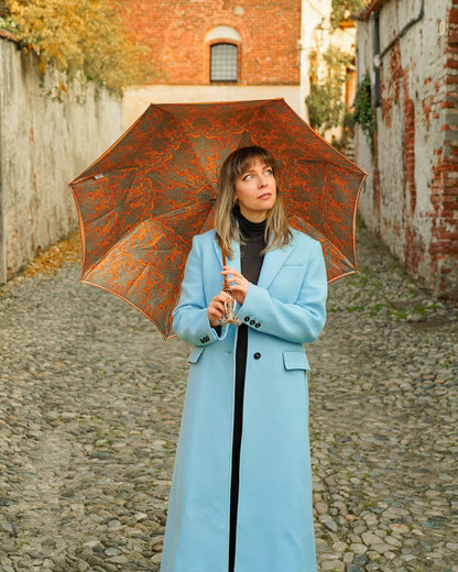 Golden Elephant umbrella with satin canopy and 24K gold handle, luxury rain umbrella from Ilmarchesato, stylish rain protection.