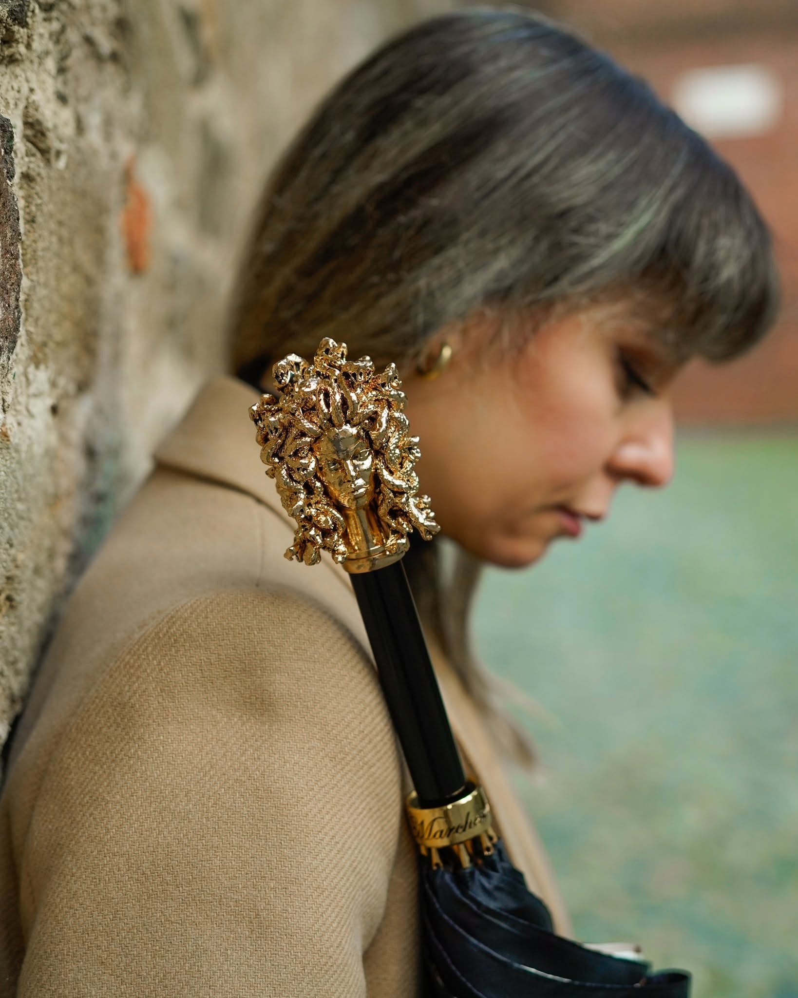 Luxury satin rain umbrella with hand-painted Medusa handle, gold accents, crafted in Italy by Ilmarchesato.