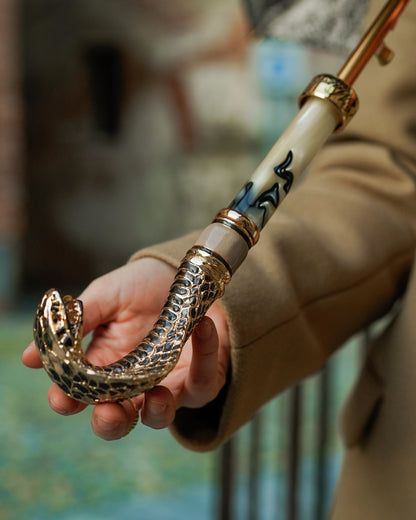 Luxury golden cobra handle rain umbrella for women by Ilmarchesato, featuring a designer handle and elegant design.