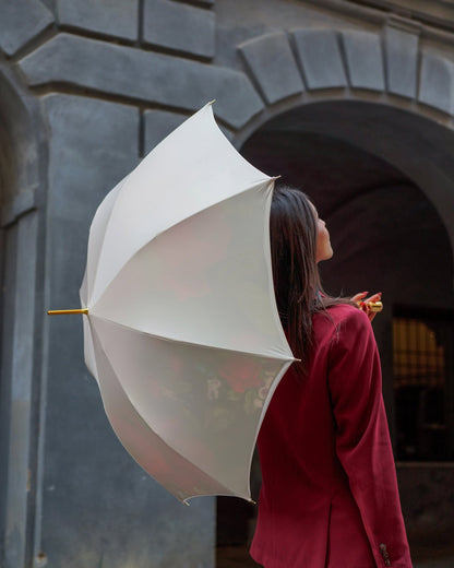 Ilmarchesato Royal Rose luxury rain umbrella with handmade gold handle and carbon fiber frame, open to show elegant design.