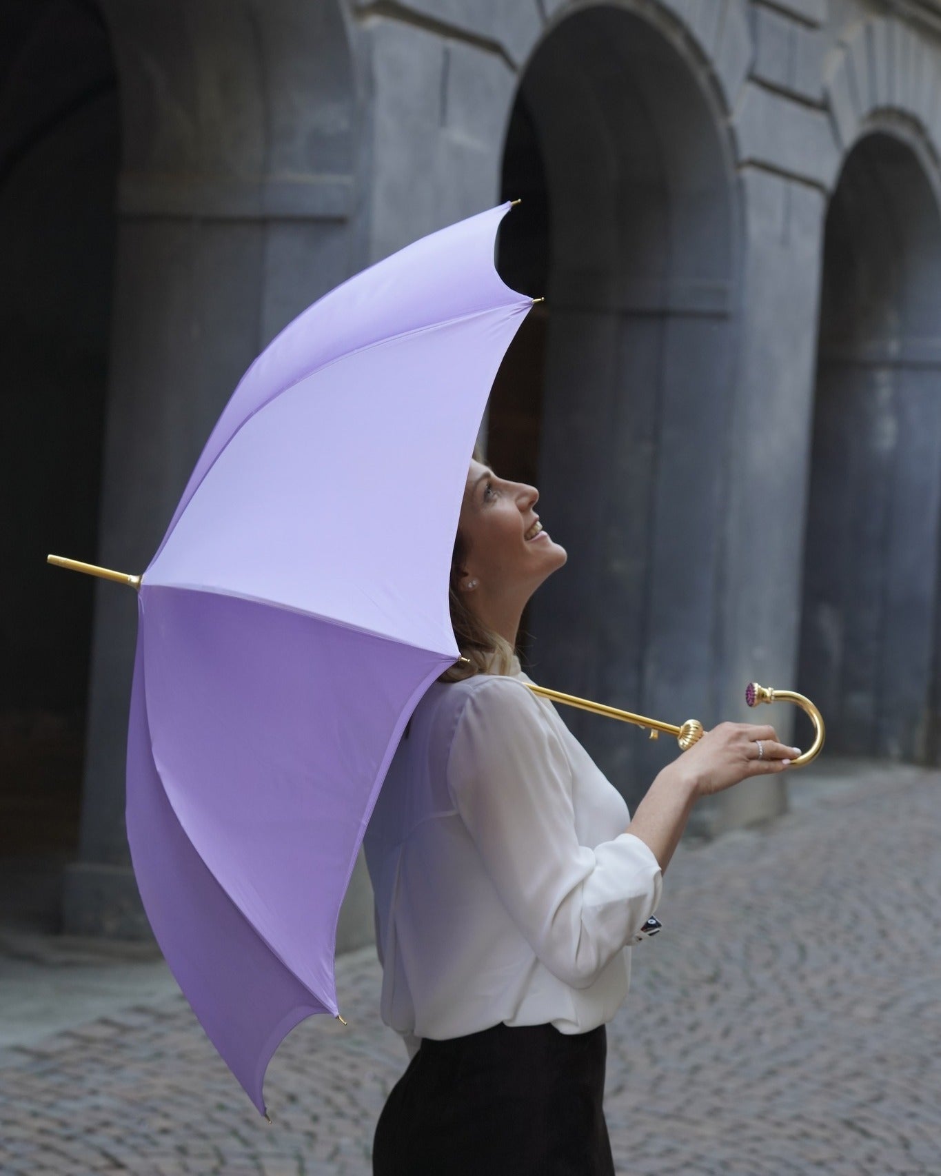 Handmade lilac satin rain umbrella by Ilmarchesato with floral pattern and amethyst crystal handle, designed for stylish protection.