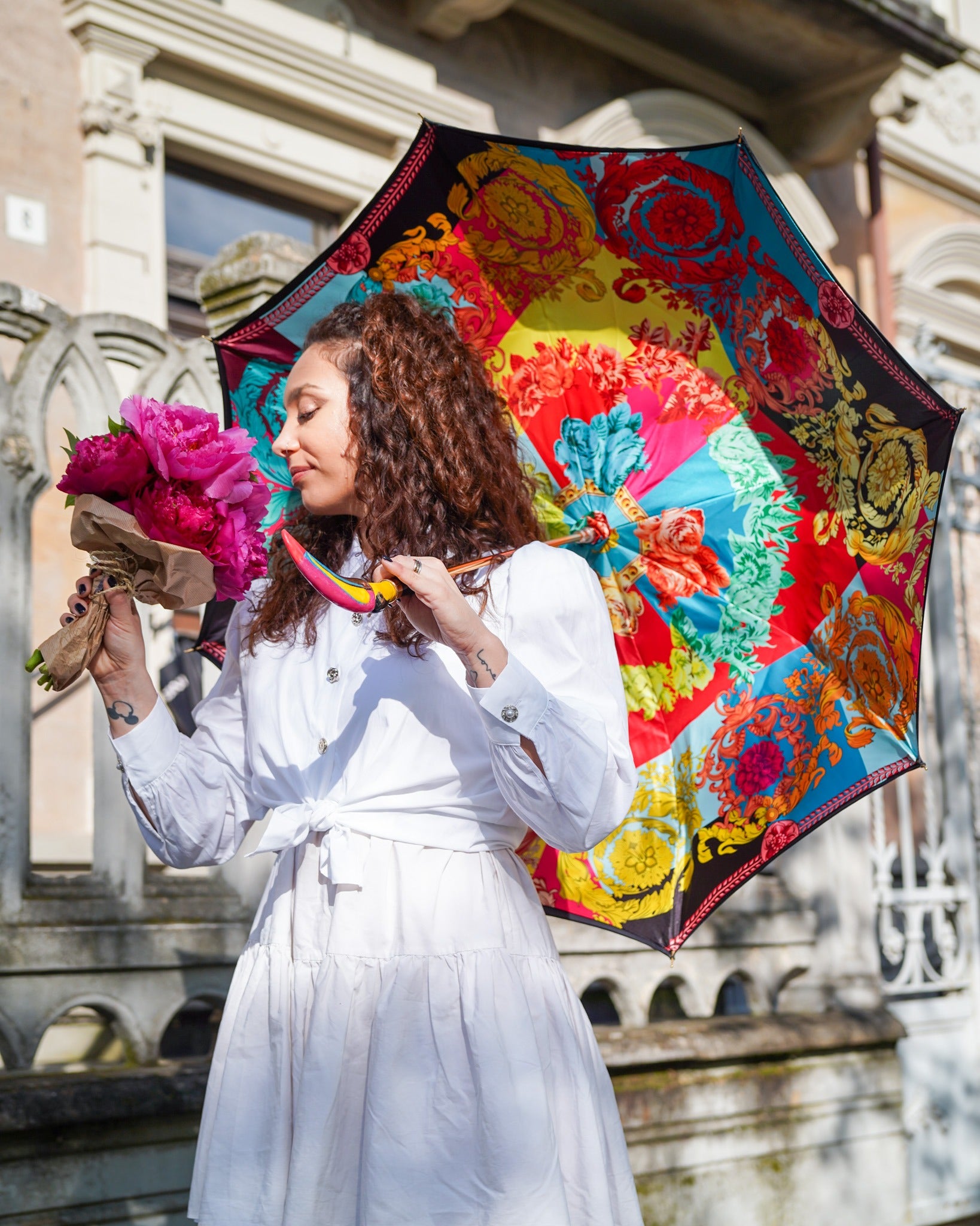 Artisan Italian rain umbrella by Ilmarchesato with handcrafted design and a 24K gold-plated toucan handle, open to show intricate craftsmanship.