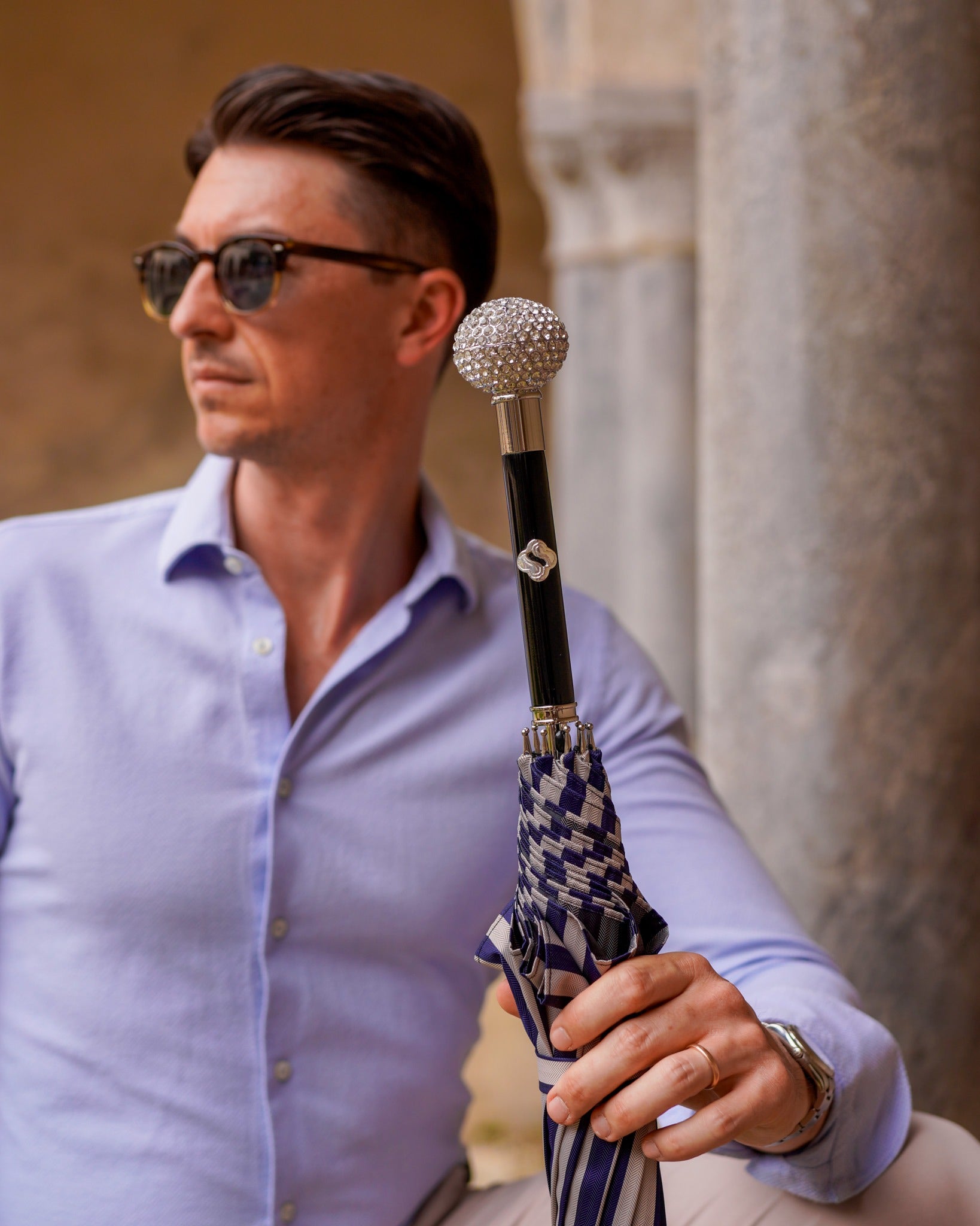 Men's luxury striped umbrella by Ilmarchesato with silverplated handle and crystal accents, featuring a stylish design and sturdy canopy.