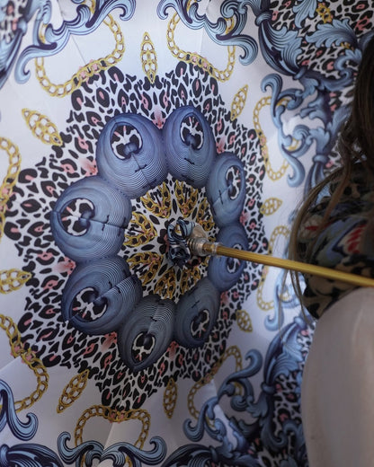 Luxury blue rain umbrella by Ilmarchesato with handmade satin canopy and turquoise crystal handle, stylish and elegant.