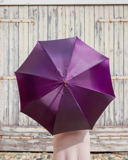 Gold plated Italian luxury rain umbrella with crystal handle, handcrafted by Ilmarchesato, stylish and elegant for rainy weather.