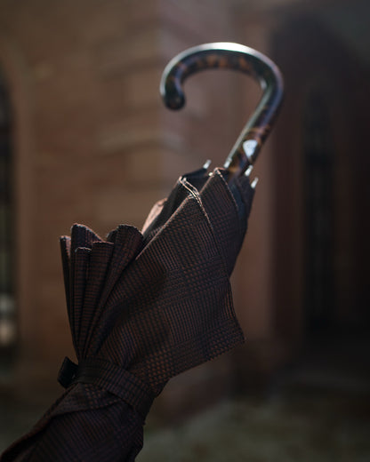 close up of a luxury handmade umbrella with a wooden handle and premium fabric