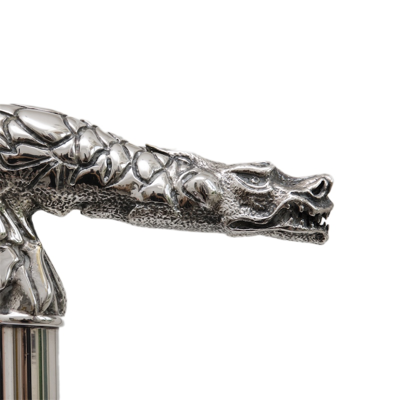 Elegant walking cane by Pasotti featuring a sculptural brass dragon handle and classic craftsmanship.