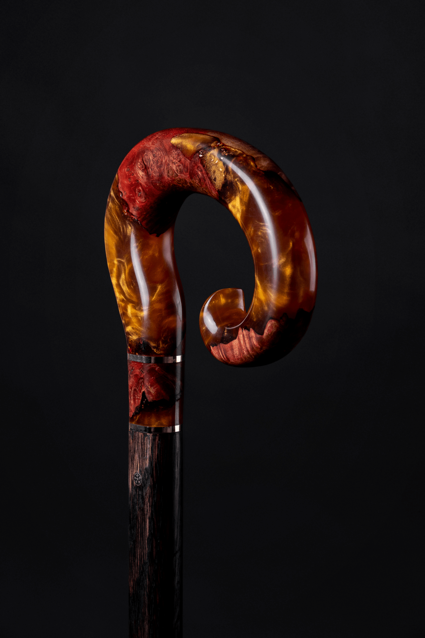 Red Mountain handmade walking cane with unique custom design, featuring detailed craftsmanship and a sturdy handle.